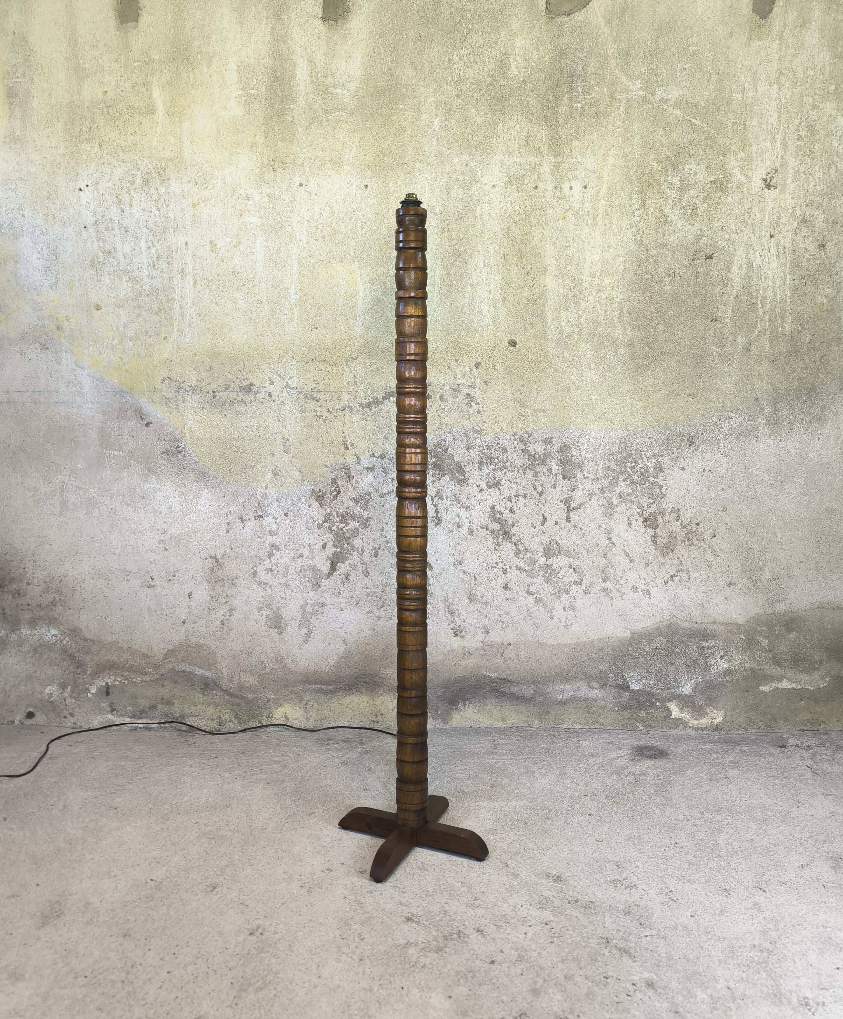 Vintage brutalist floor lamp made of turned wood.