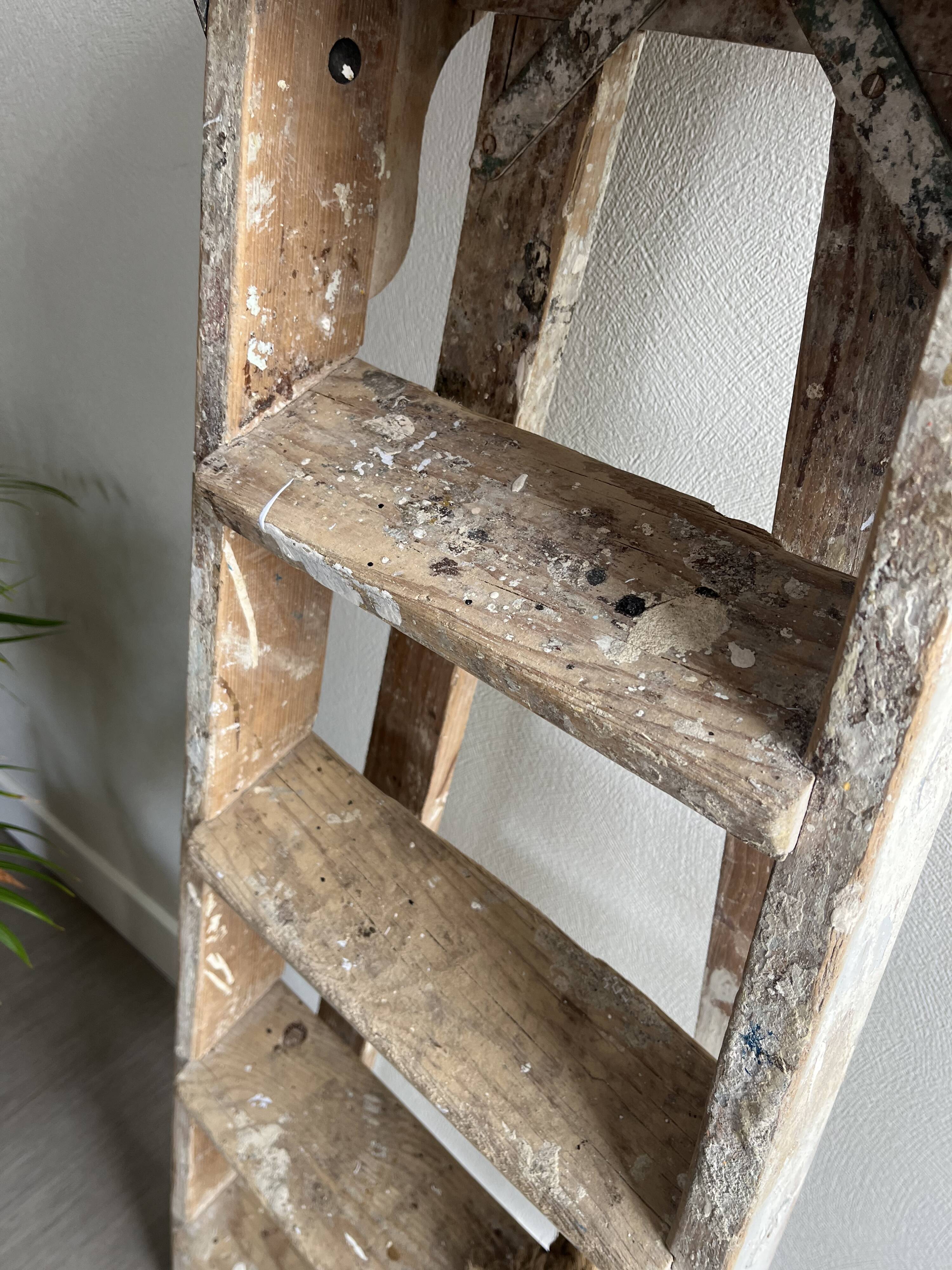 Former stepladder of patinated wood painter