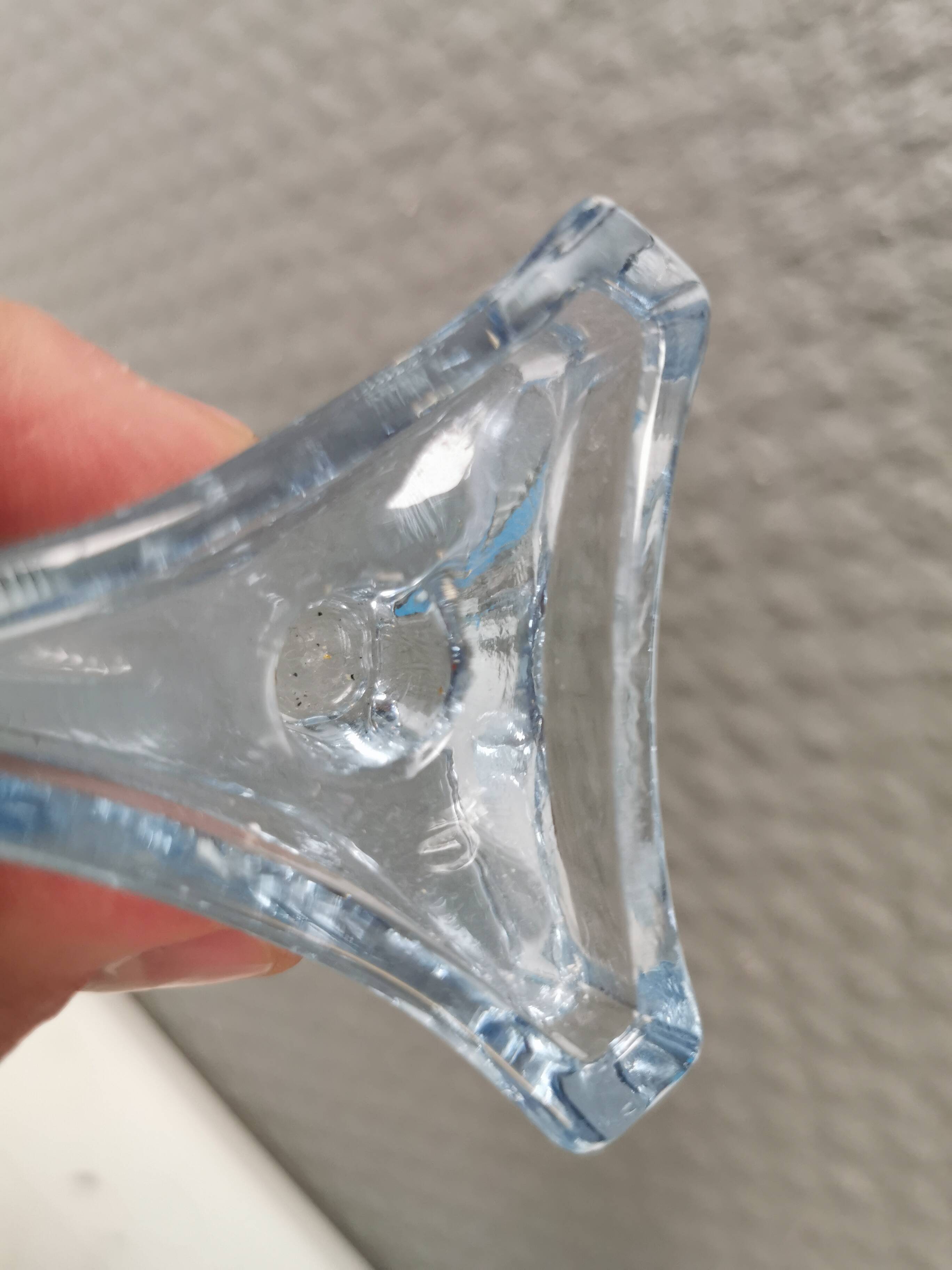Two beautiful glass candle holders in translucent bluish glass.