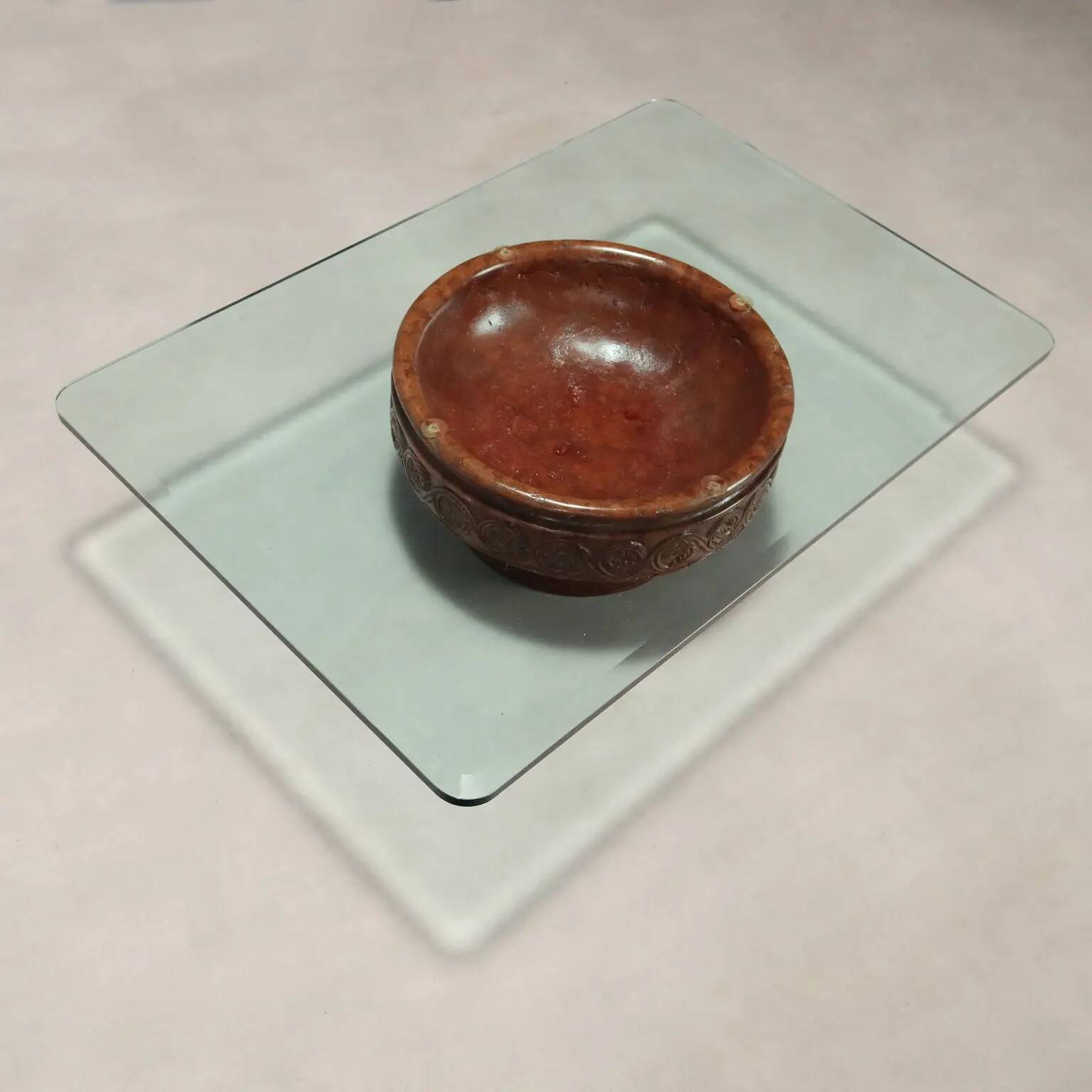 Vintage coffee table with a glass top and a terracotta base, 20th century.