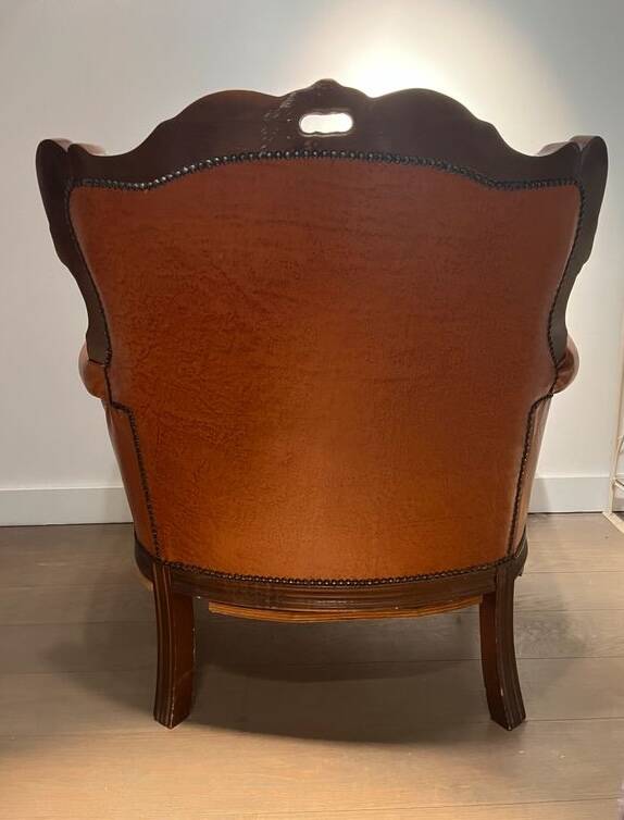 Chesterfield-style leather armchair