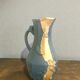 Large decorative blue-grey pitcher with swallow mouldings and gold leaf.