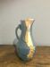 Large decorative blue-grey pitcher with swallow mouldings and gold leaf.