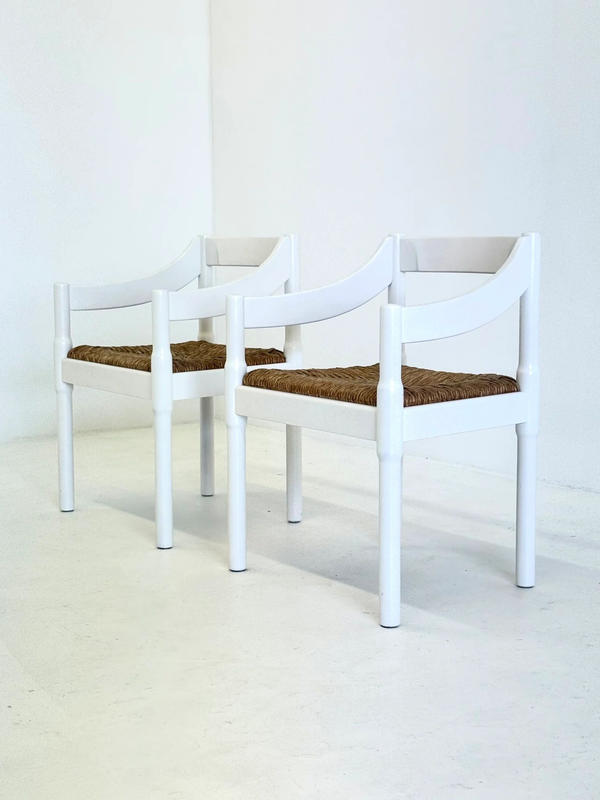 Set of two Carimate chairs by Vico Magistretti in white
