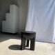 Black mango wood tripod side table with a semi-spherical top, height: 45 cm, diameter: 44 cm.
