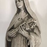 Religious statue of sainte therese of lisieux “the little flower of jesus” in stone