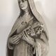 Religious statue of sainte therese of lisieux “the little flower of jesus” in stone