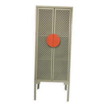 Vintage sage green metal wardrobe with openwork doors and coral handles.
