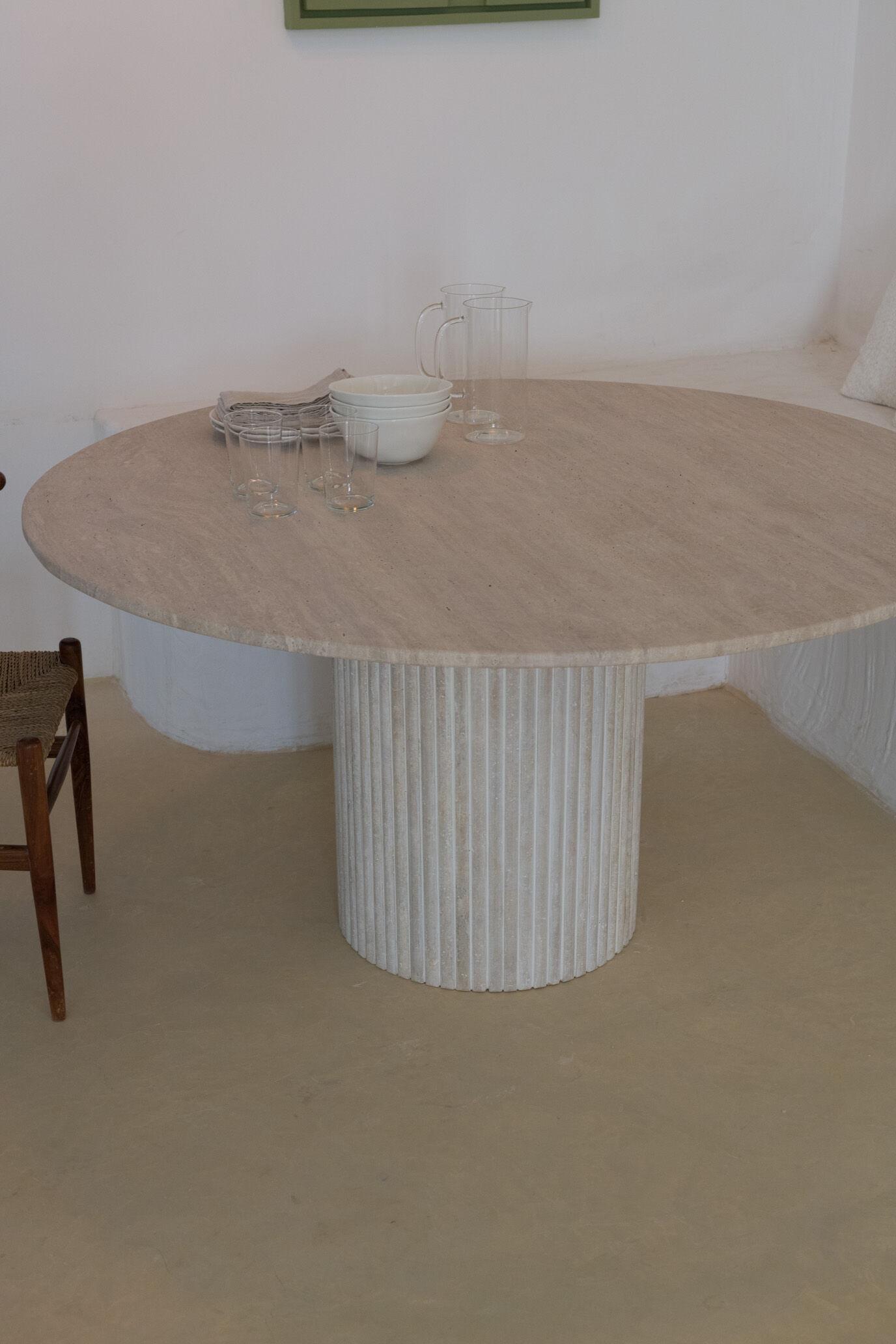 Omega circular dining table in natural travertine