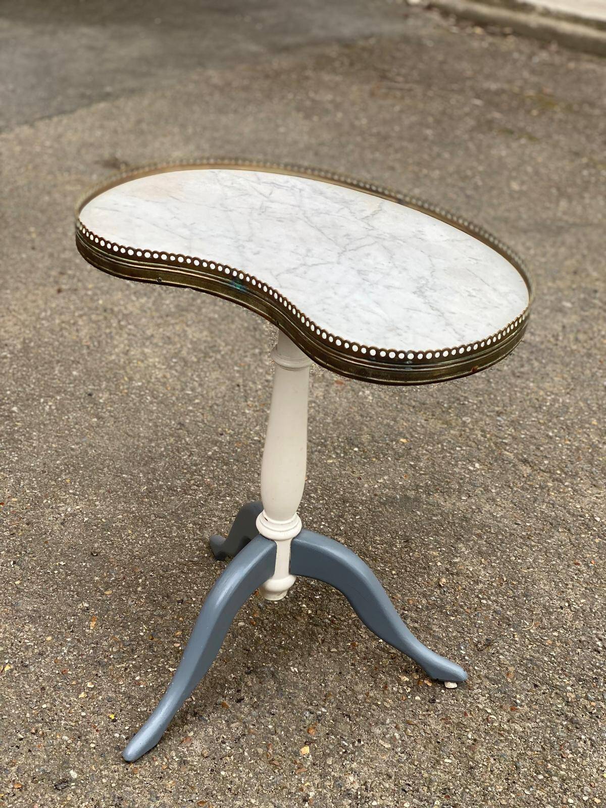 Pair of marble and ivory tripod pedestal tables