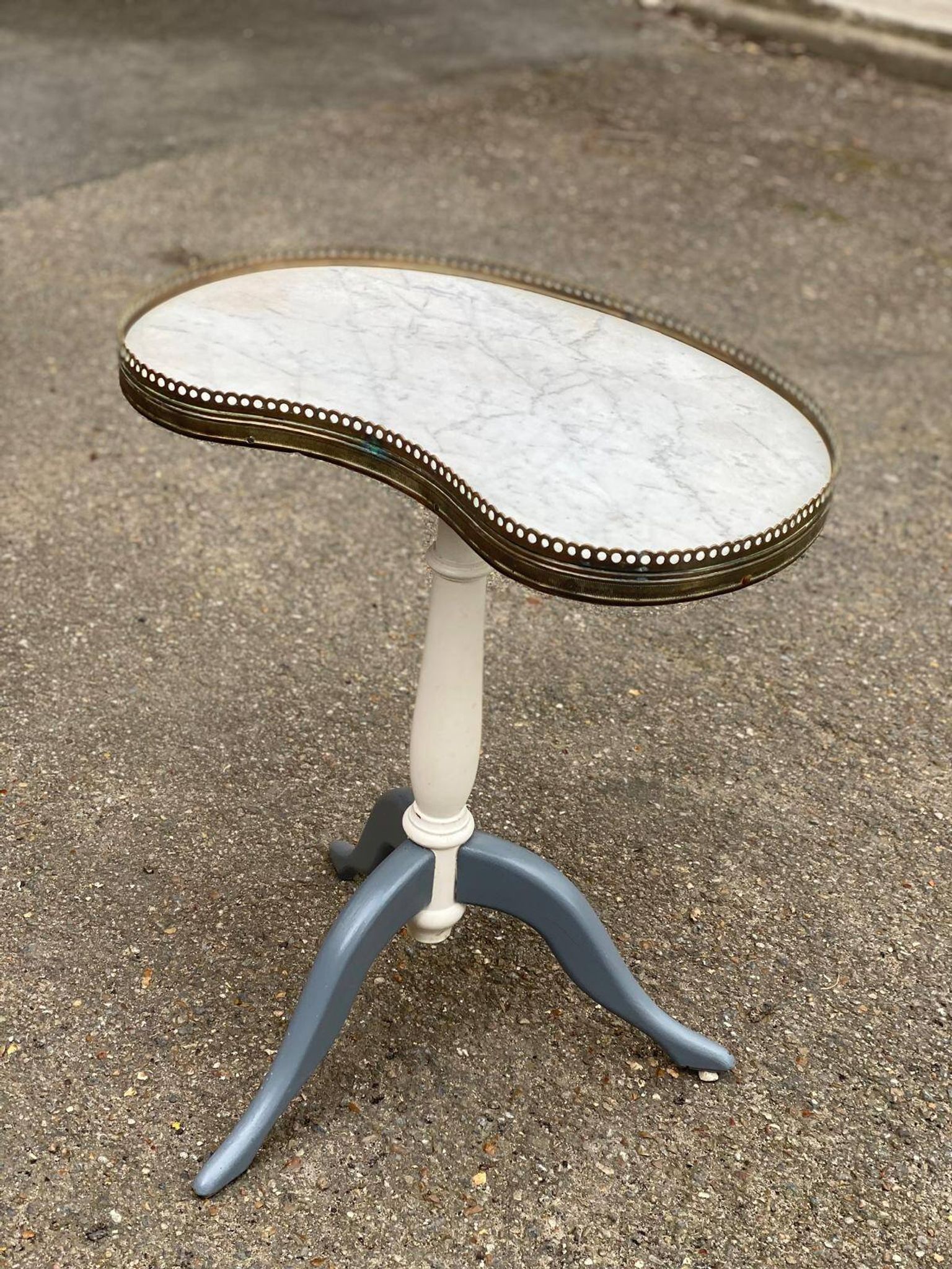 Pair of marble and ivory tripod pedestal tables