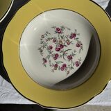 Set of 9 large vintage yellow deep plates with pink flowers and a gold rim.