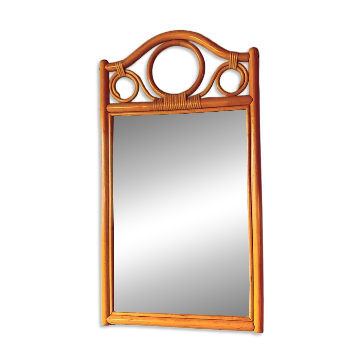 Curved wooden mirror and rattan