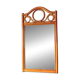 Curved wooden mirror and rattan