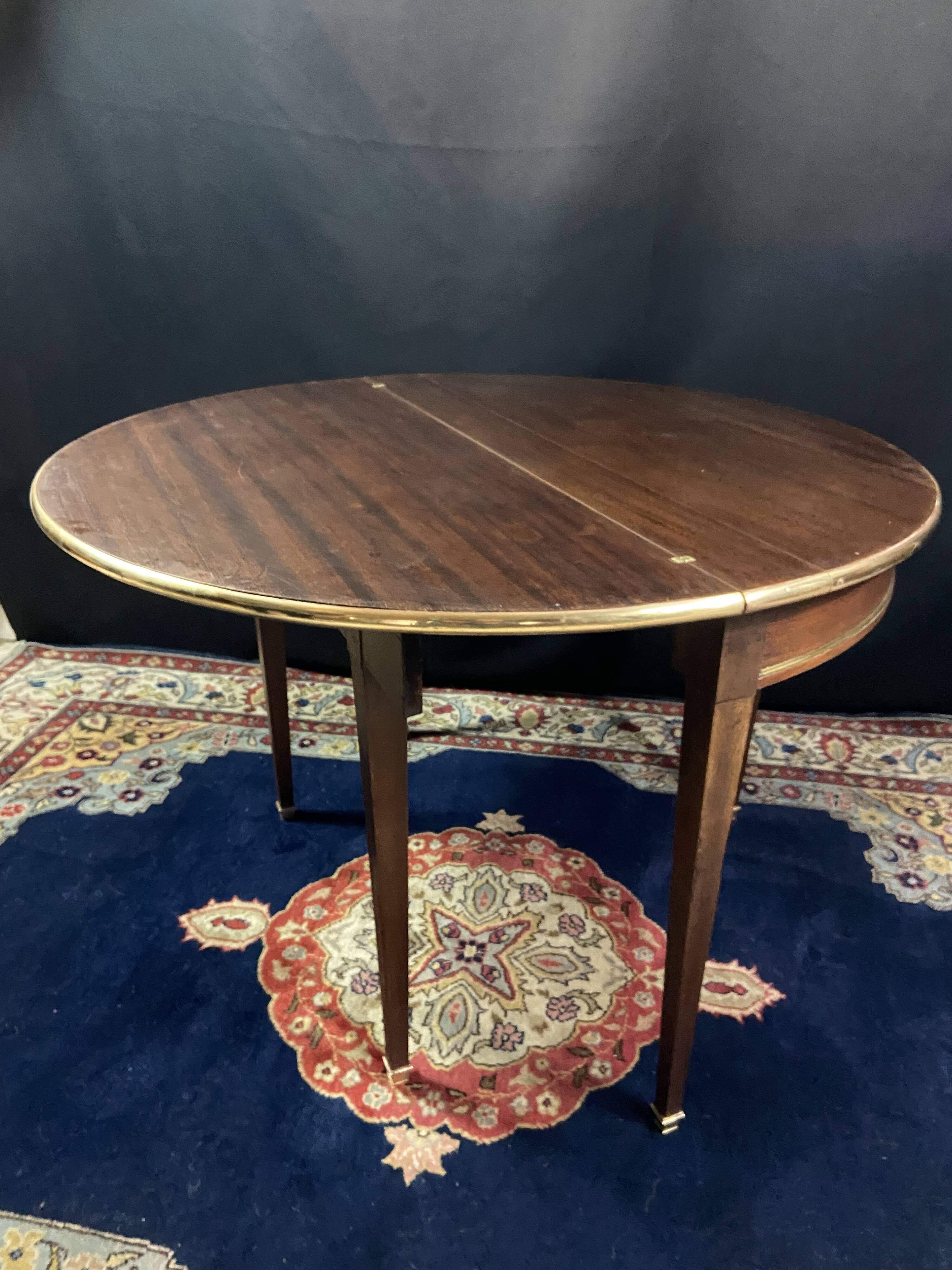 Console table demi-lune 19th century Louis XVI modular foldable top in mahogany.