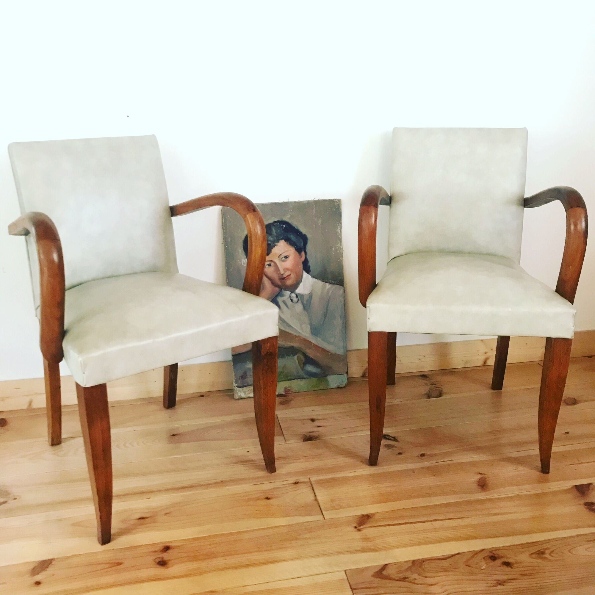 Pair of vintage armchairs in wood and imitation leather