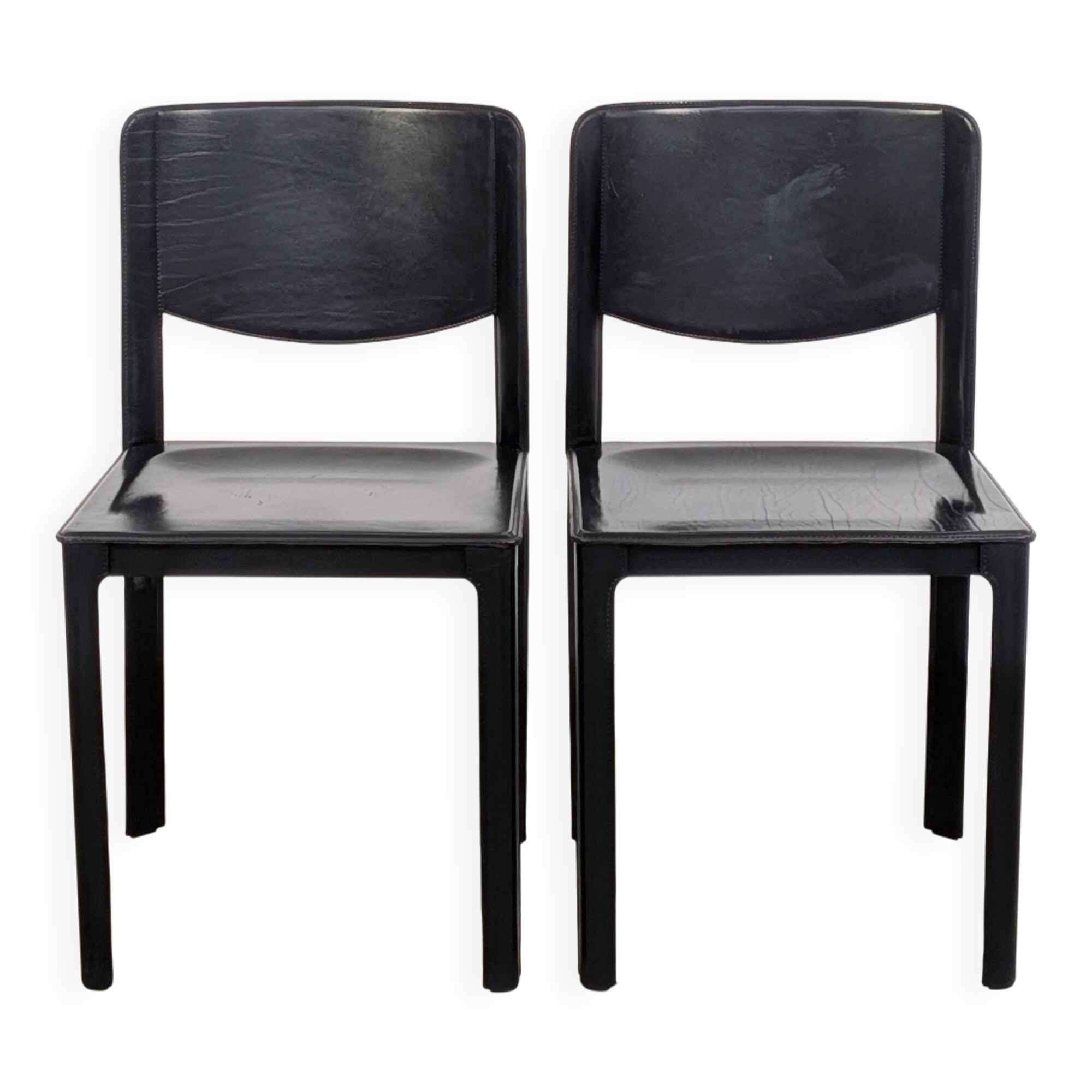 Pair of Matteo Grassi chairs in black saddle leather, 1980s.