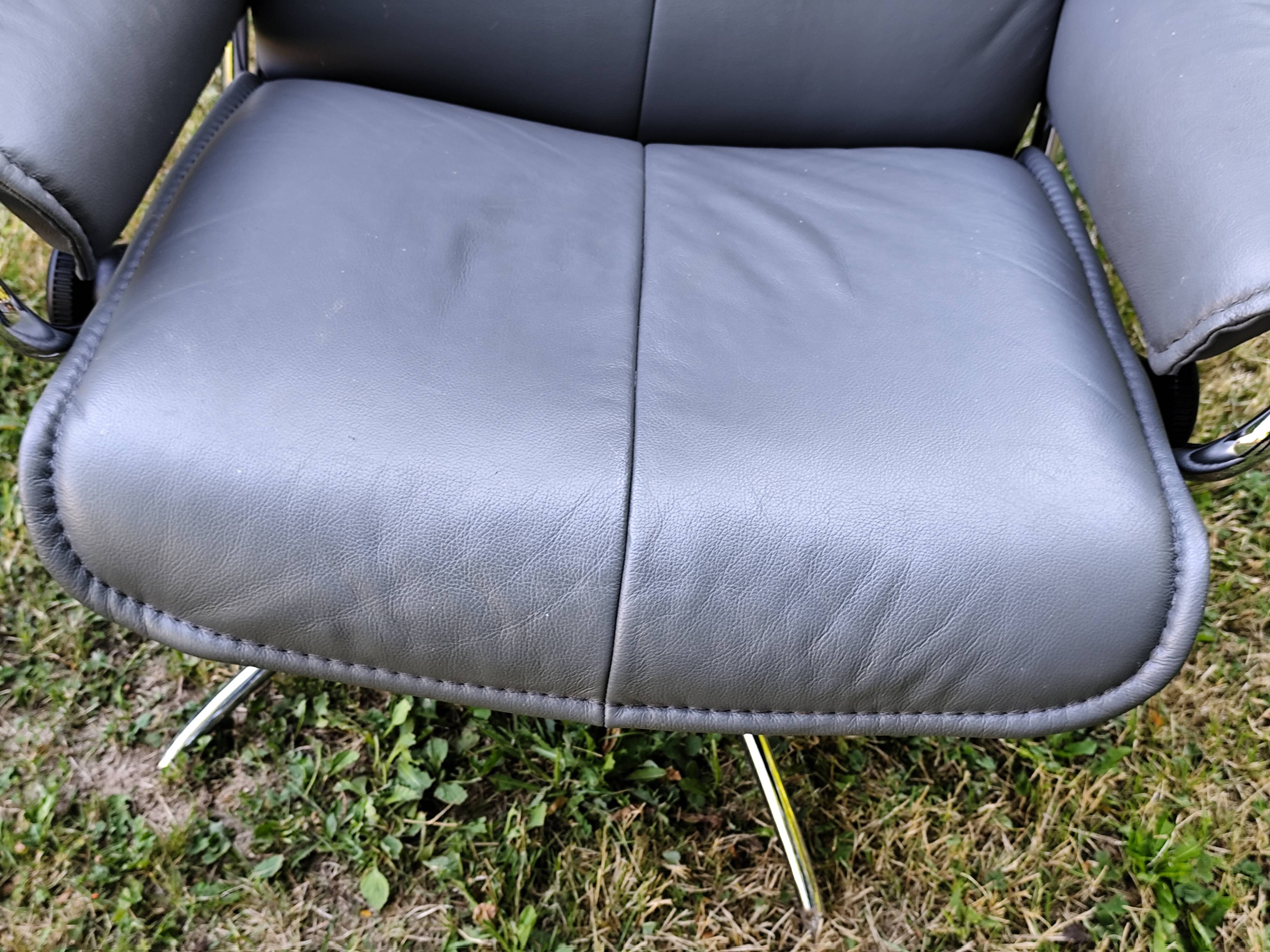 Stressless City armchair with footrest/ottoman, grey