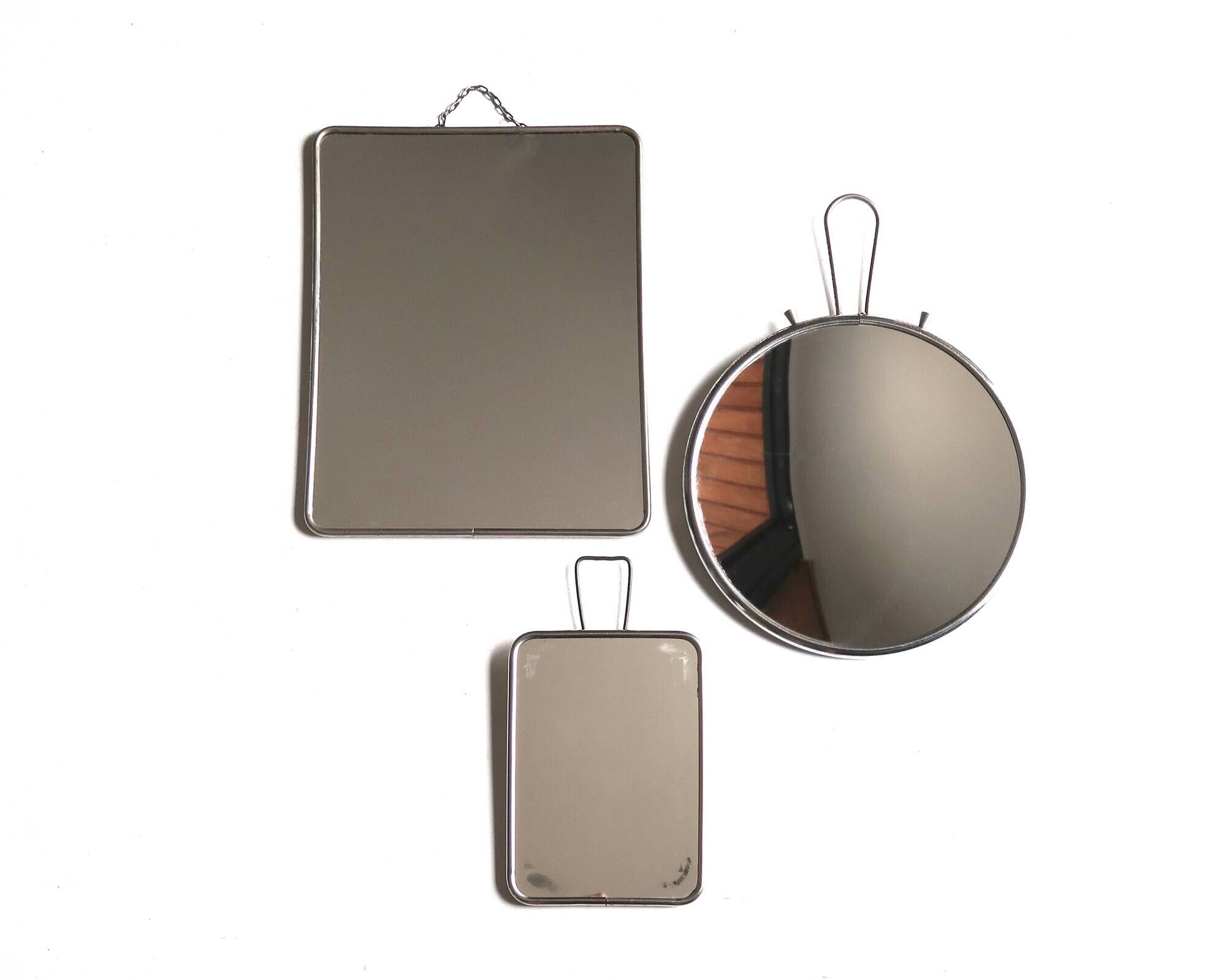 Set of 3 rectangular and round magnifying barber mirrors, 1950s.