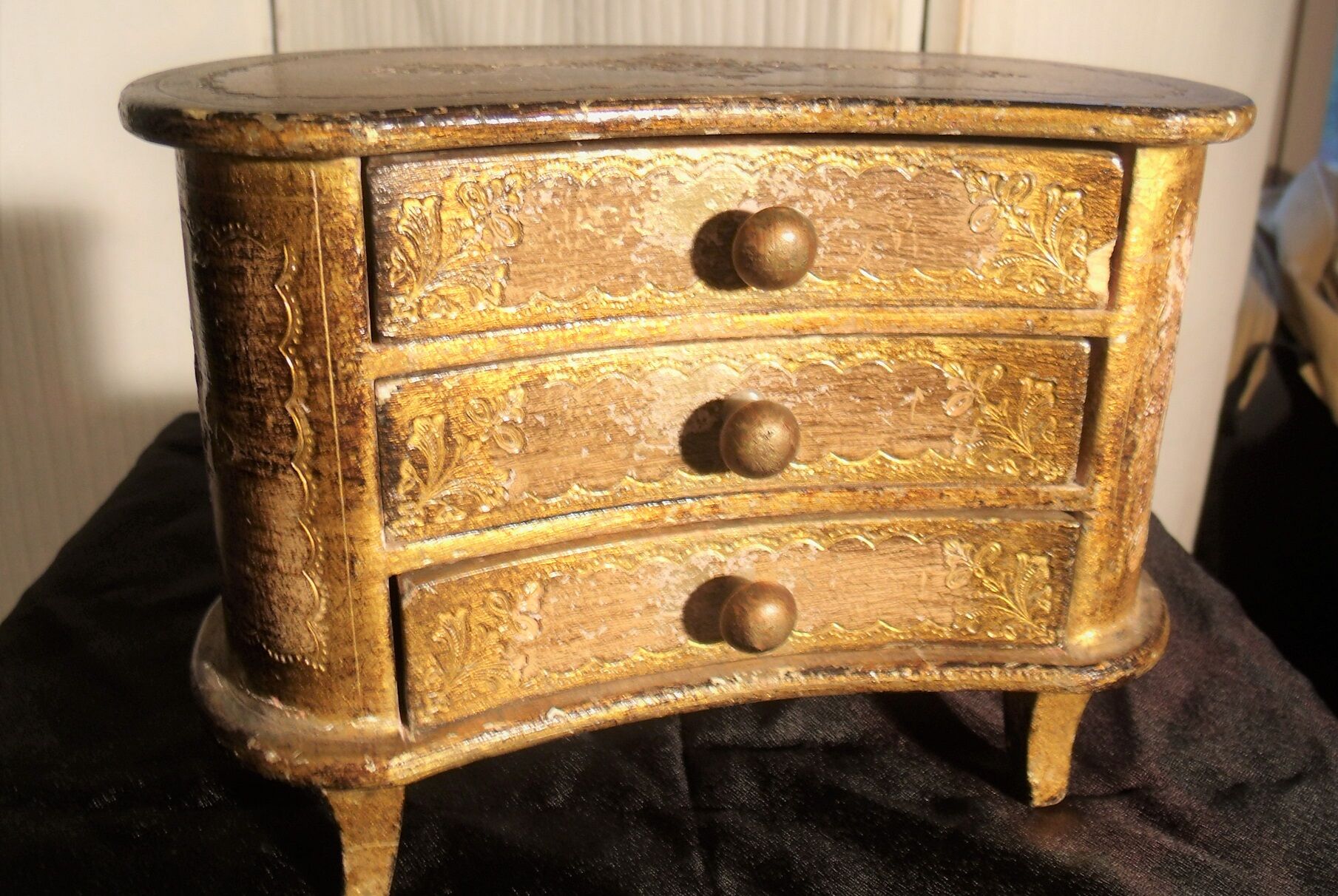 Jewelry box with gilded wooden drawers