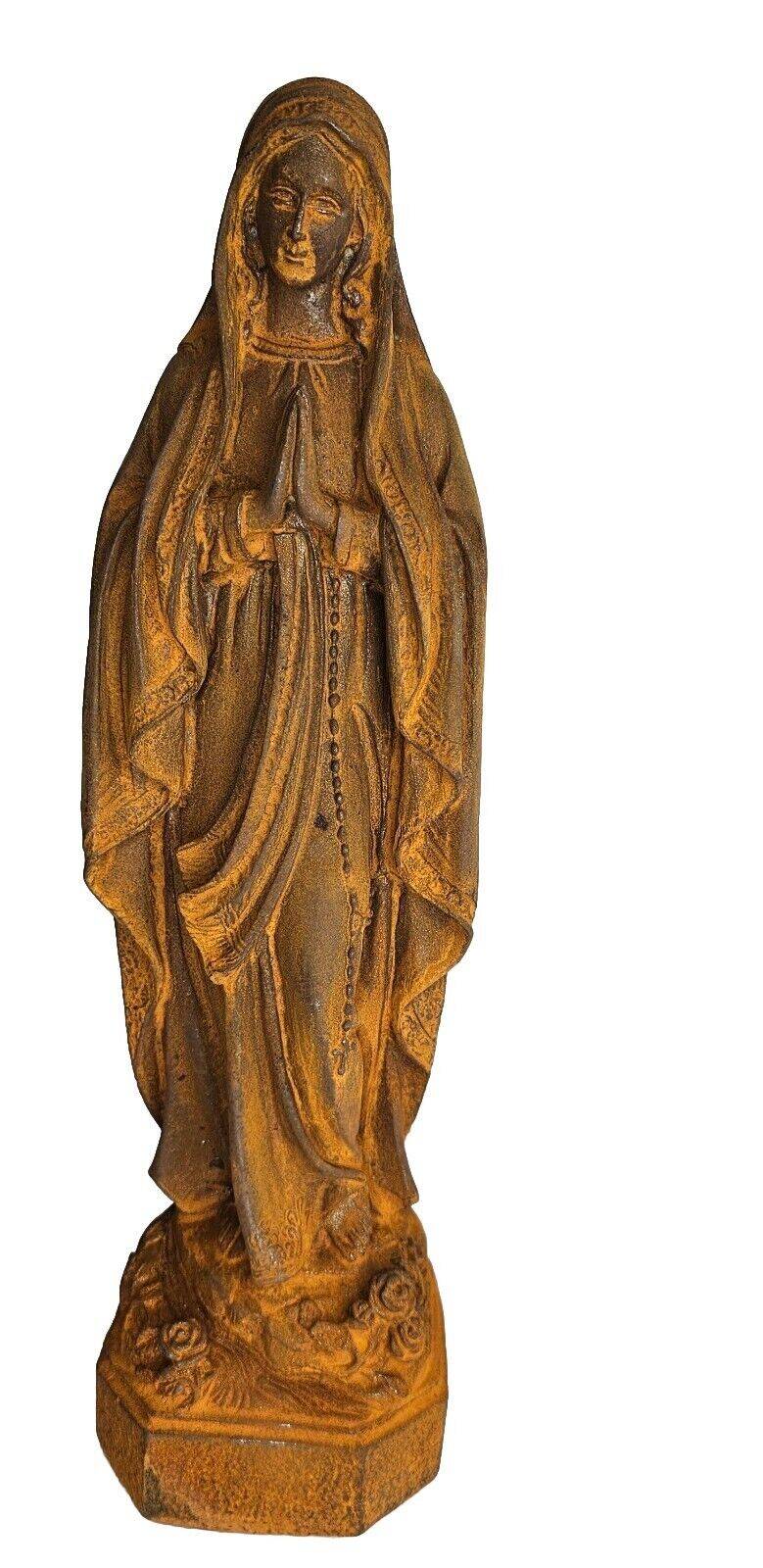 cast iron statue of the virgin
