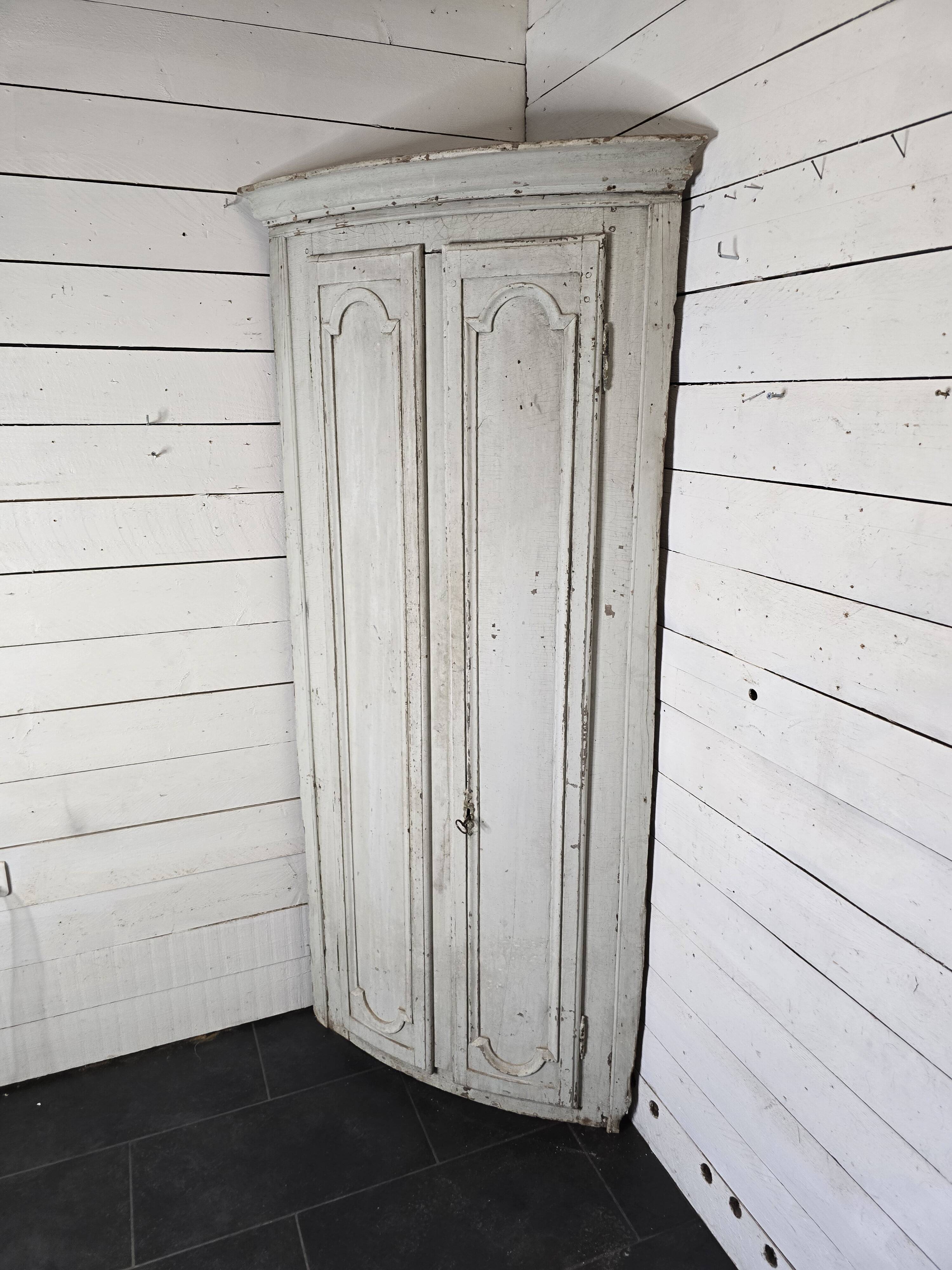 19th century curved corner cupboard in patinated oak