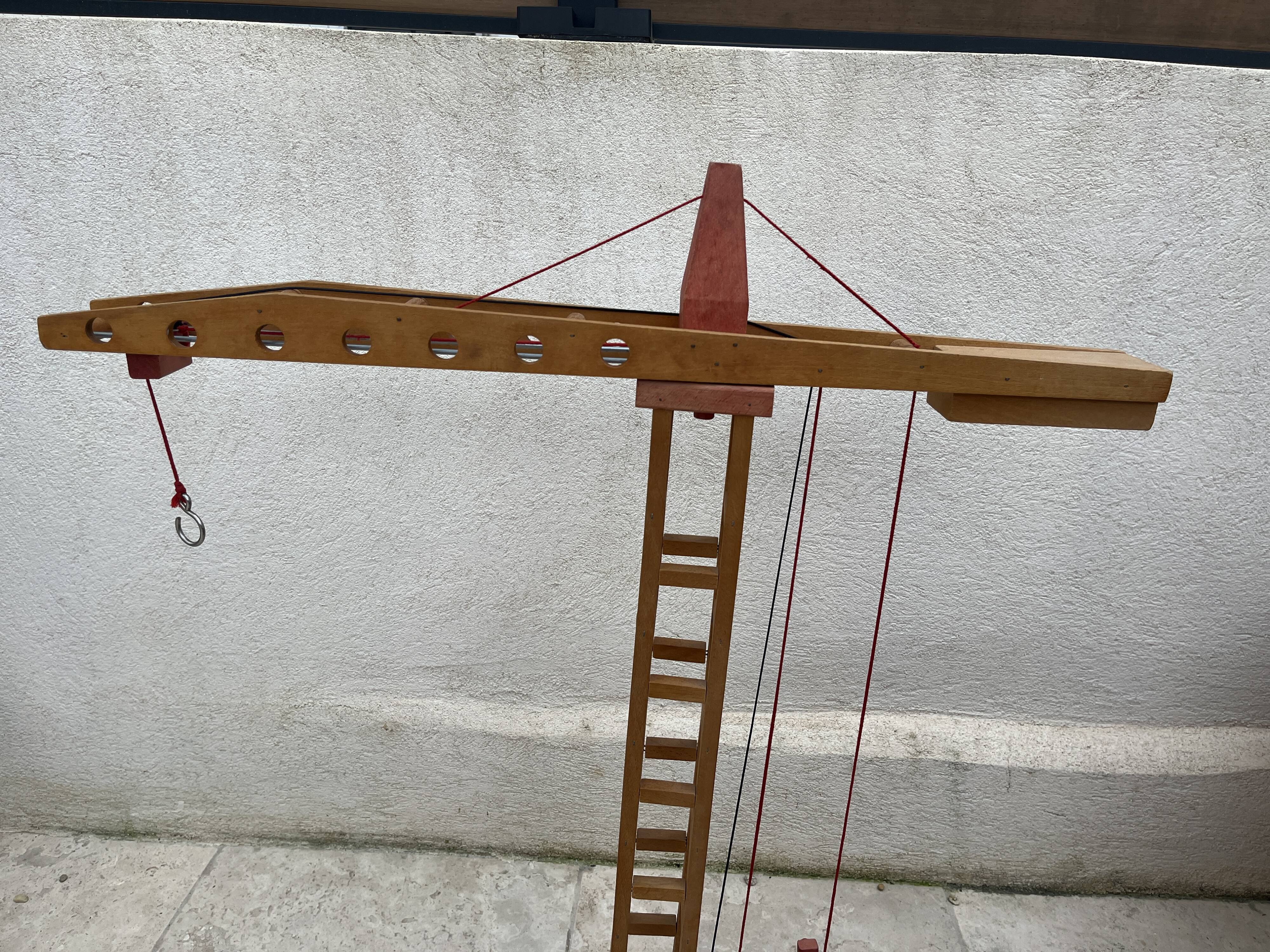 Vintage wooden crane toy from the 60s