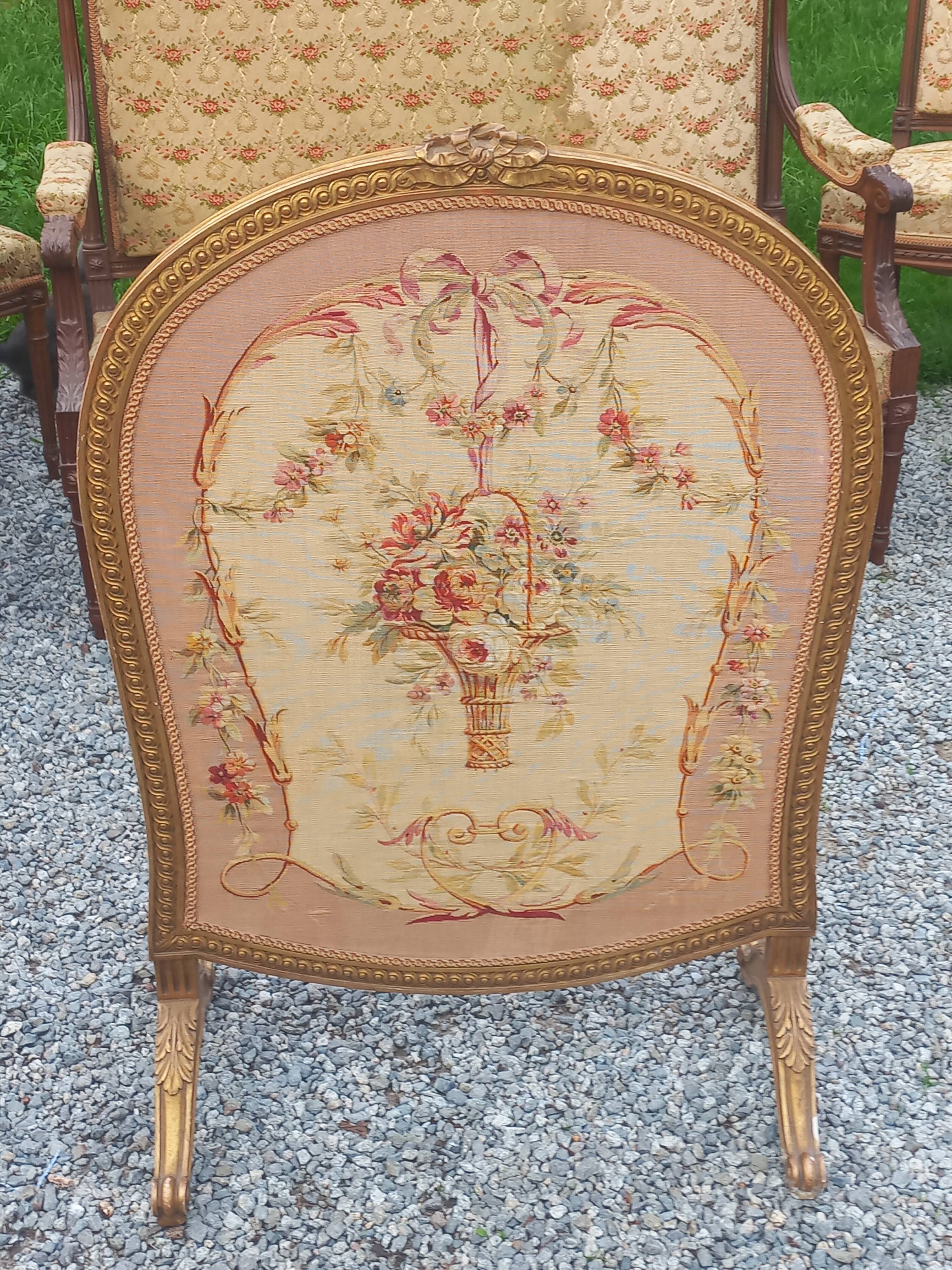Golden wooden fireplace screen and Aubusson tapestry, 19th century.