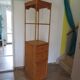 Storage column, wooden bookshelf and woven rattan.