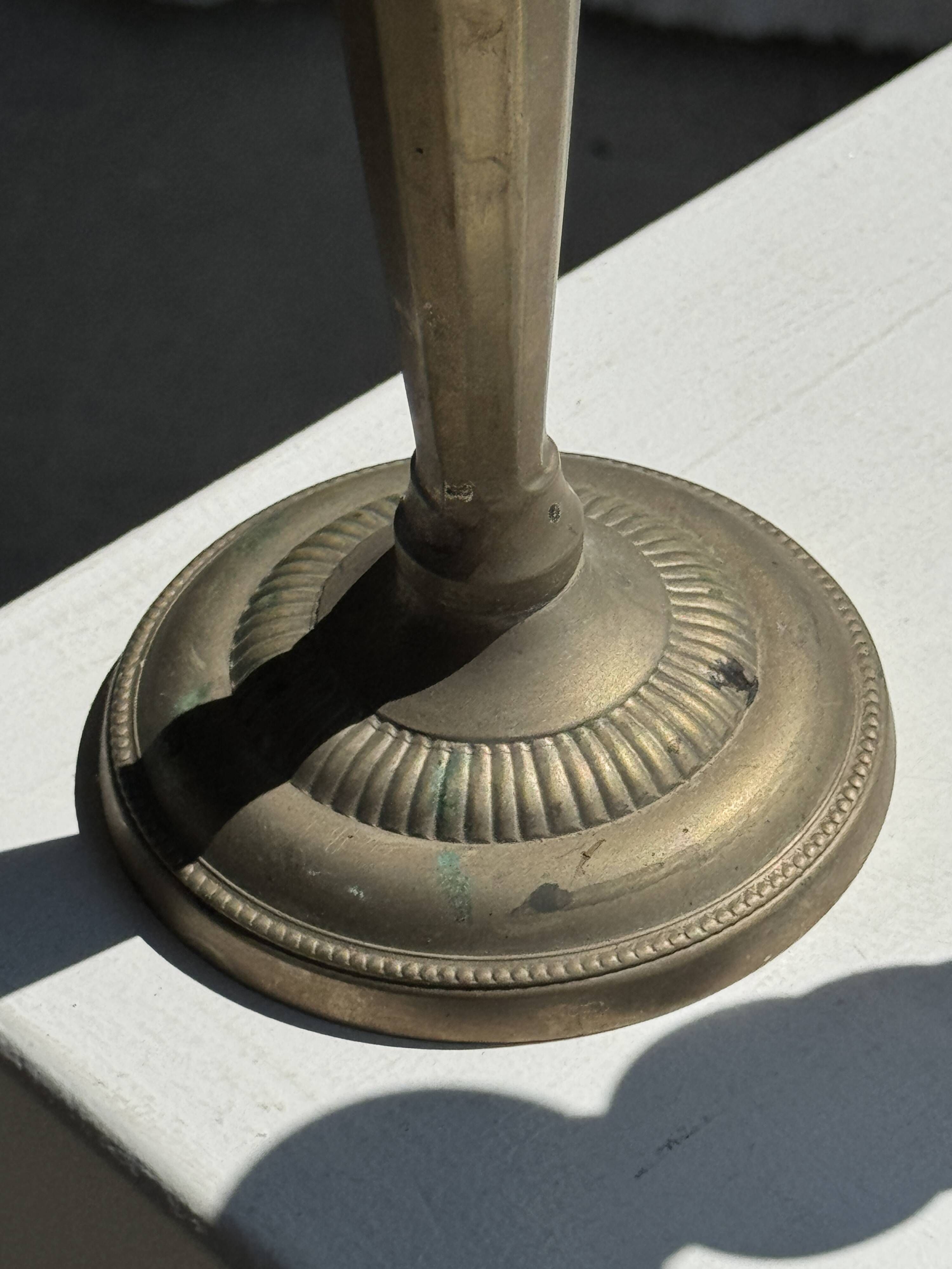 Pair of classic candlesticks in patinated gold metal H25