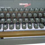 Hermes 2000 portable typewriter with its carrying suitcase