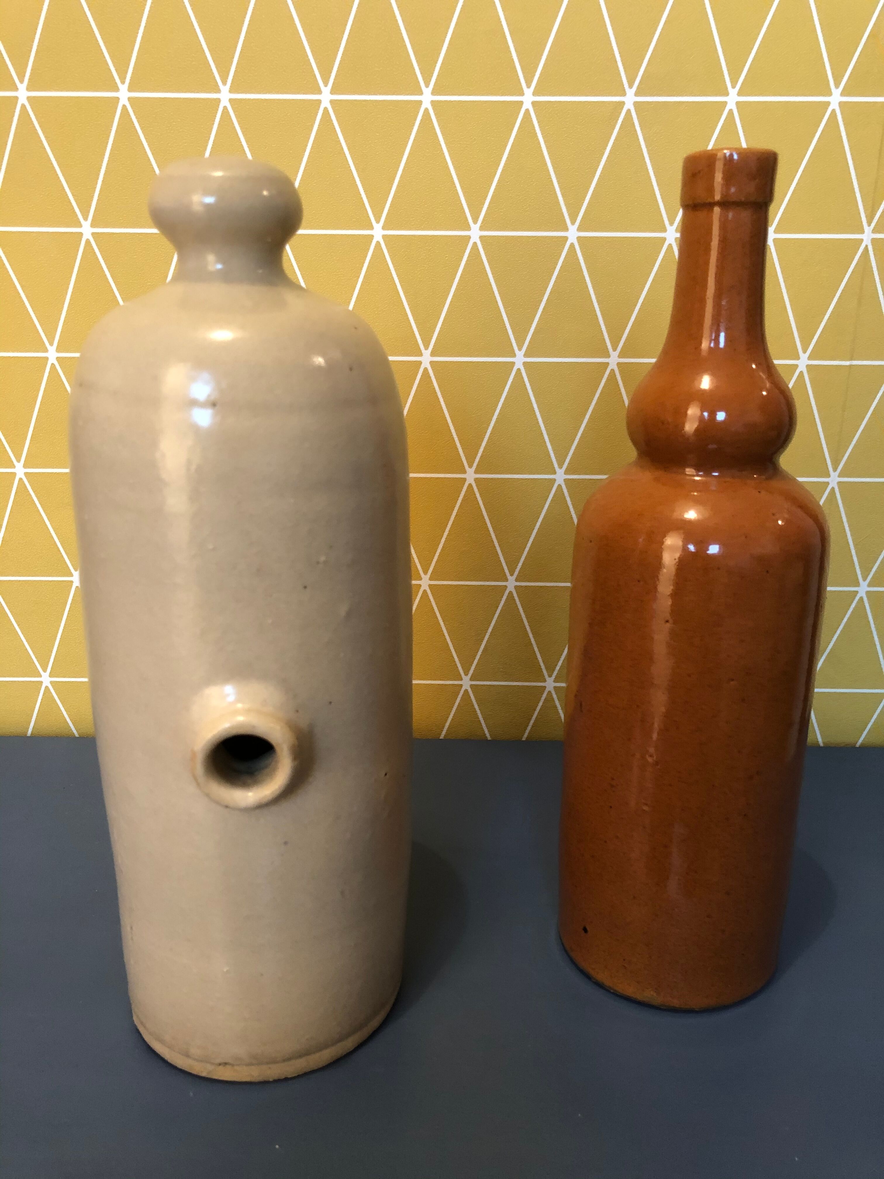 Duo of sandstone bottles