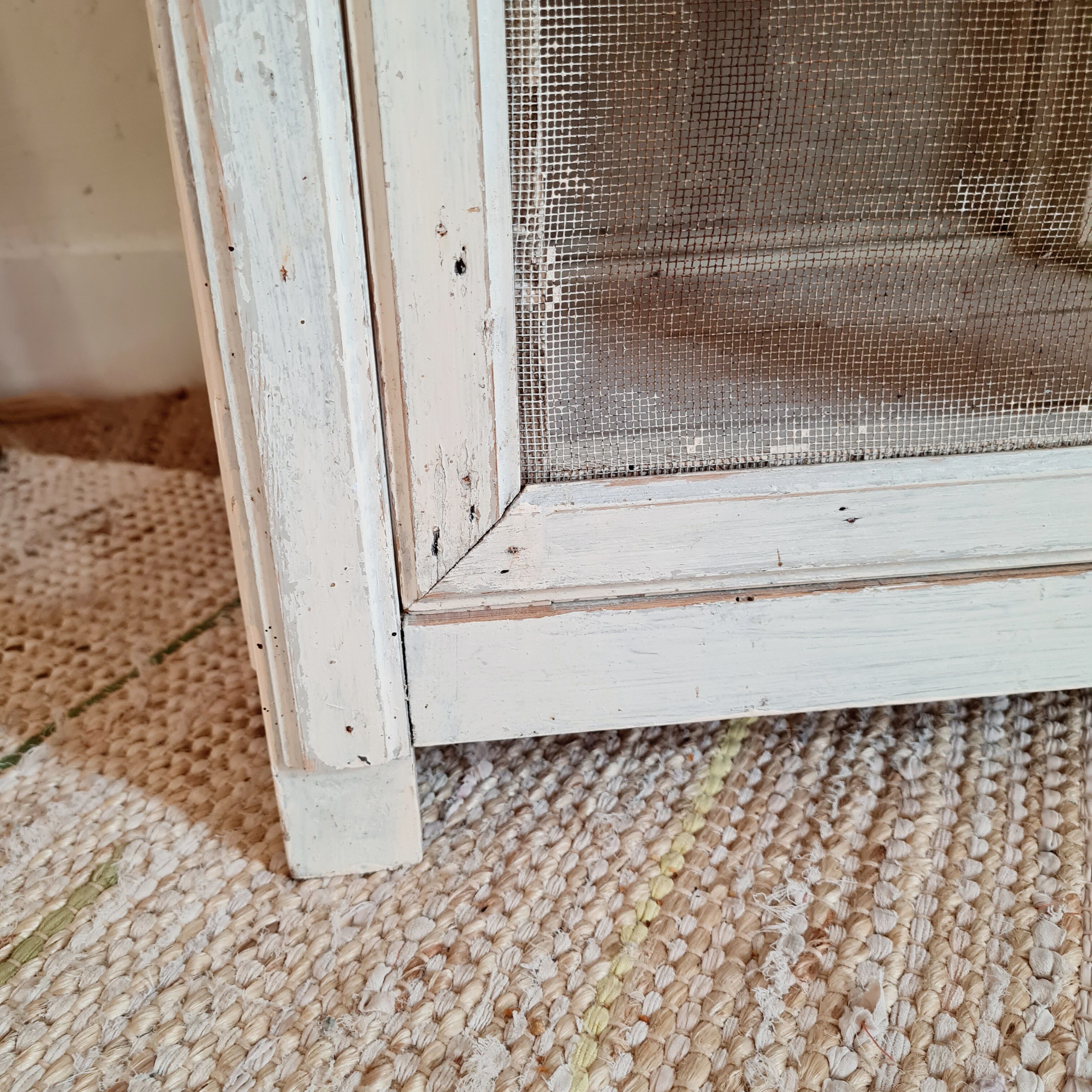 Wooden pantry and white mesh
