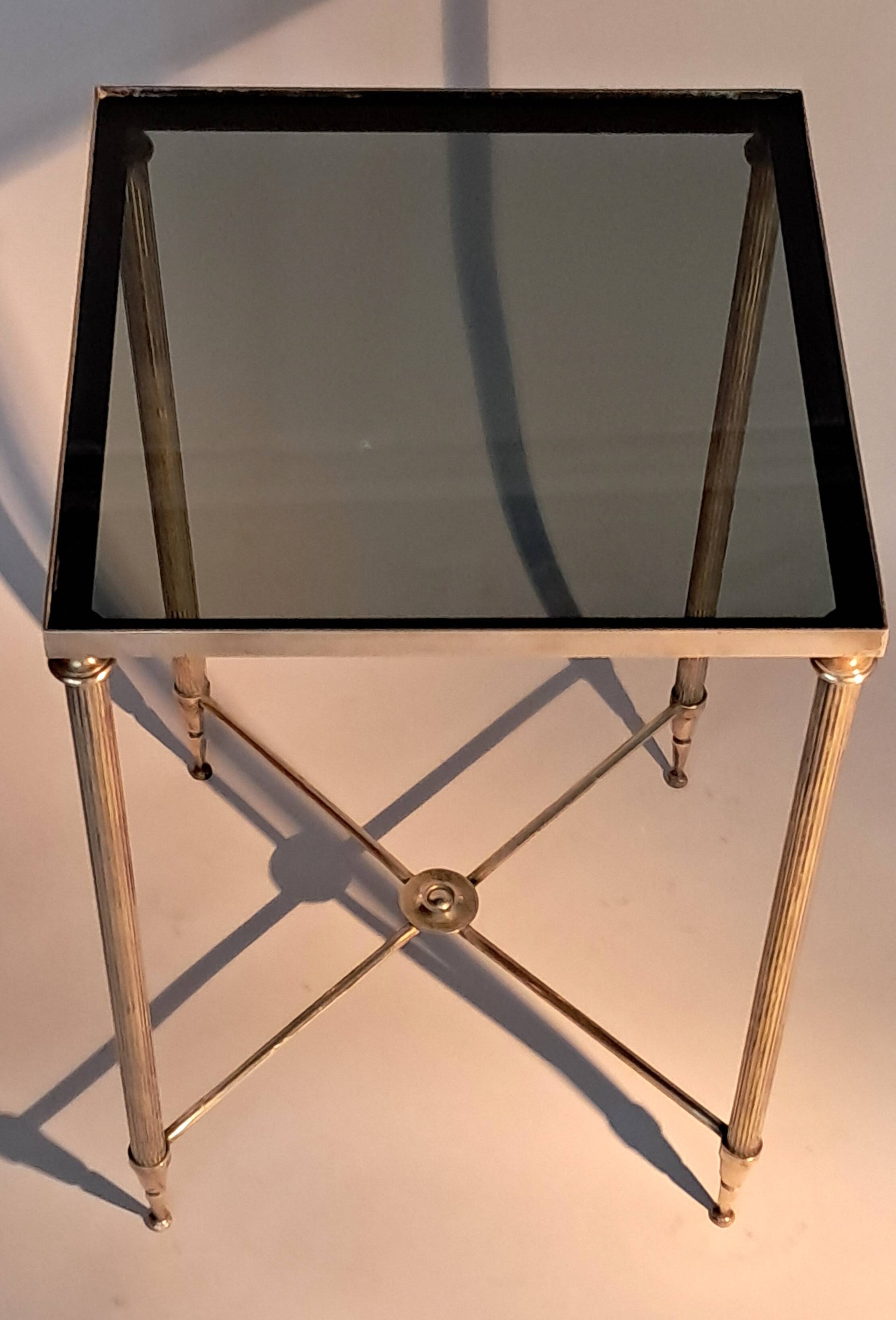 Gold brass side table in neoclassical style, circa 1960.