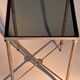 Gold brass side table in neoclassical style, circa 1960.