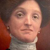Old painting, portrait of a woman from the early 20th century.