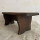 Old low stool made of solid wood