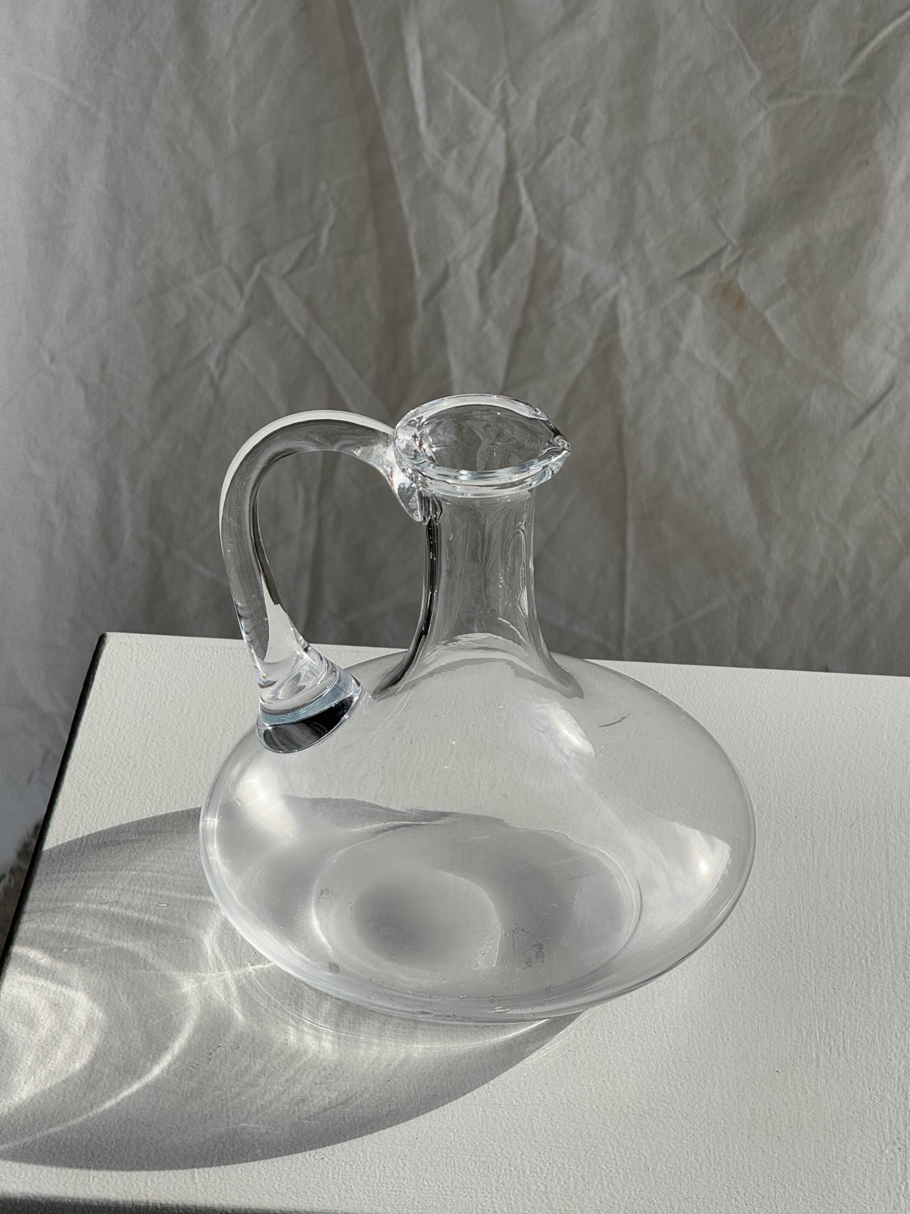 Vintage glass carafe with flattened flared belly handle H18