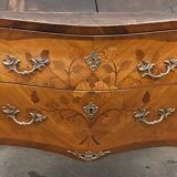 Curved and inlaid Louis XV style chest of drawers