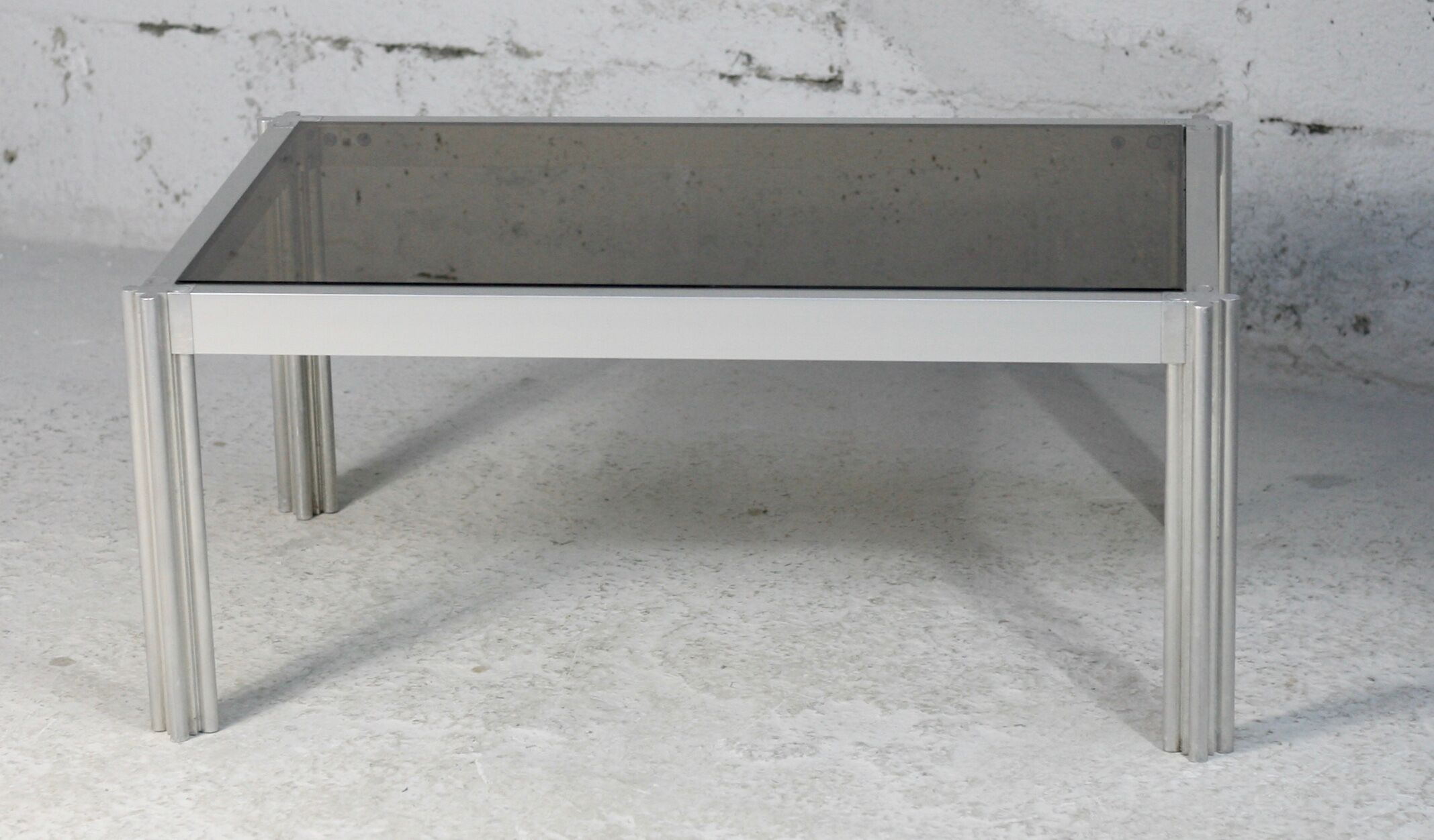 International Furniture. Steel coffee table and smoked glass. Circa 1970