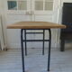 Table, tubular pedestal metal gray slate, oak tray marked