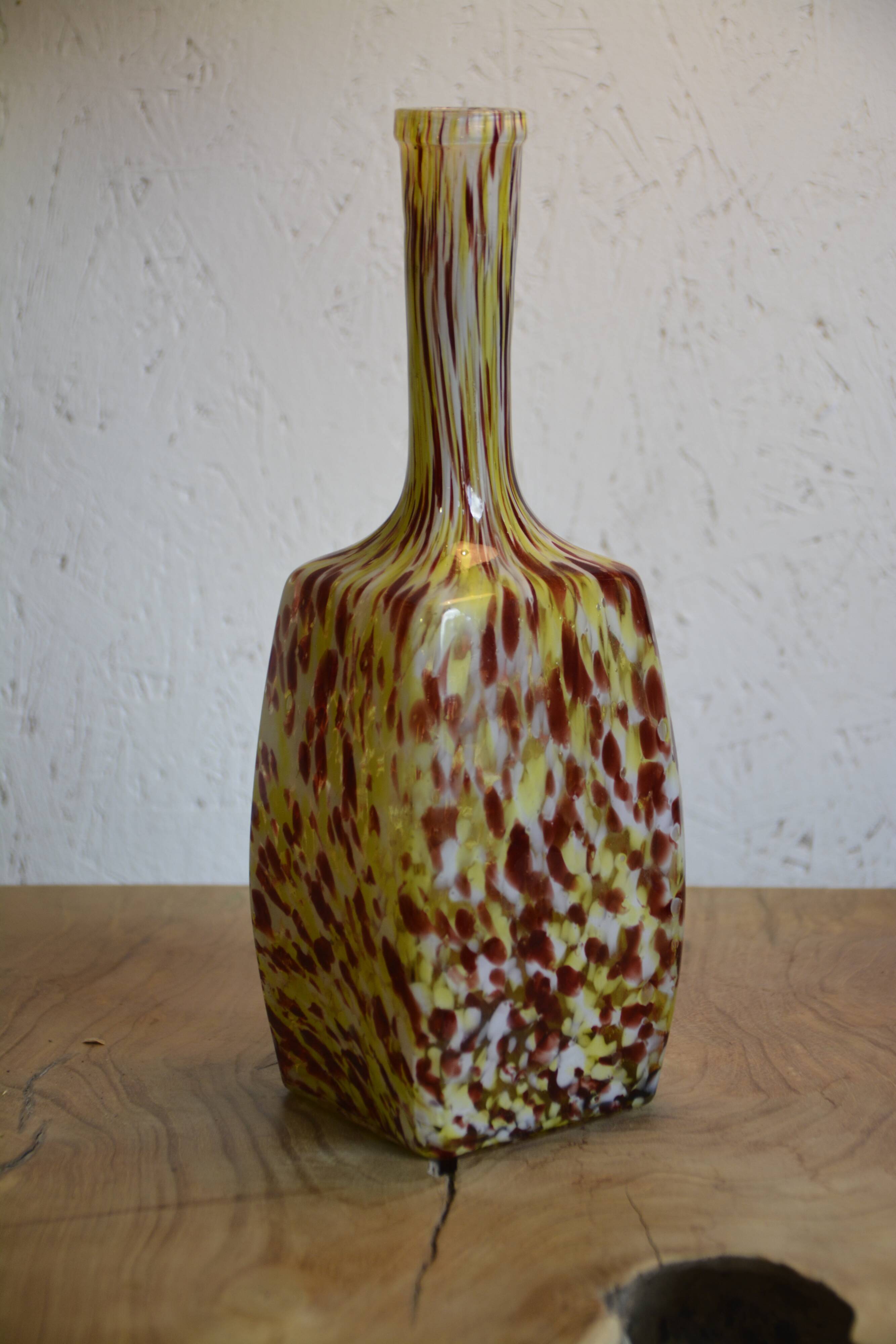 Yellow and white speckled decanter