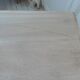 Console table in walnut with drop-leaf extensions, grey patinated base.
