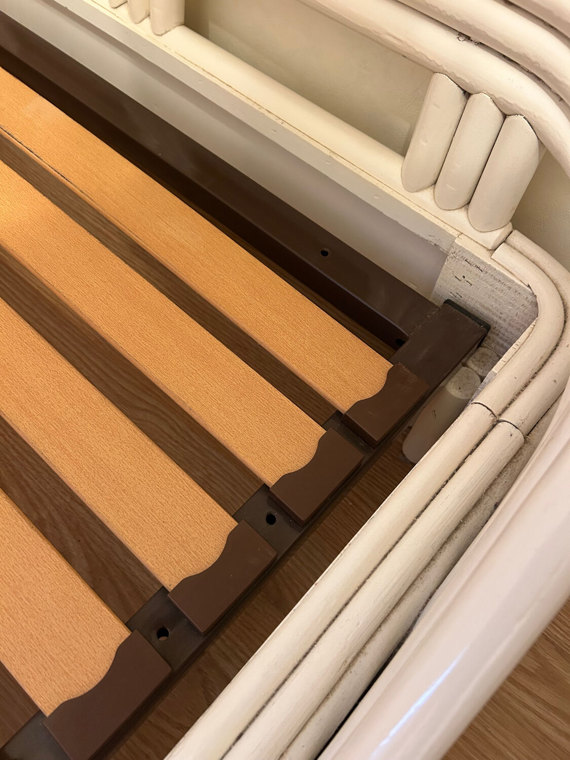 Vintage white rattan bed from the 1960s.