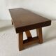 Low stool in varnished wood