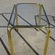 Nested table in gold metal and glass