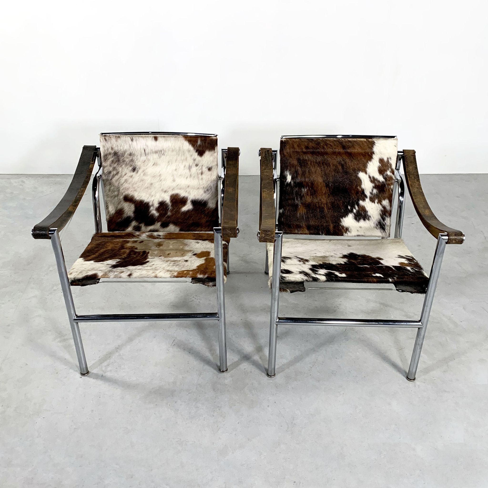 Pair of LC1 cow skin chairs by Le Corbusier for Cassina 1970