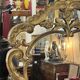Mirror with carved and gilded wooden frame, 18th century, with scrollwork decoration.