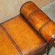 Vintage Spanish window bench in hand-stitched leather and restored iron.
