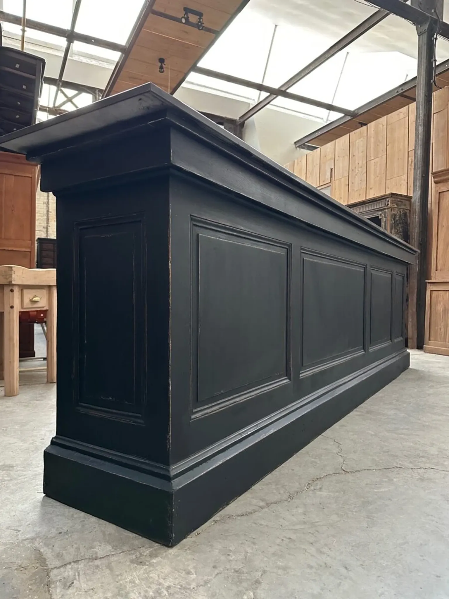 Immense bar counter covered with blue stone.